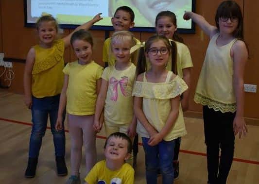Pupils wear yellow to promote mental health awareness.