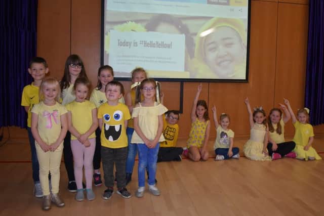 Grangetown Primary youngsters hold their Hello Yellow Day to promote good mental health.