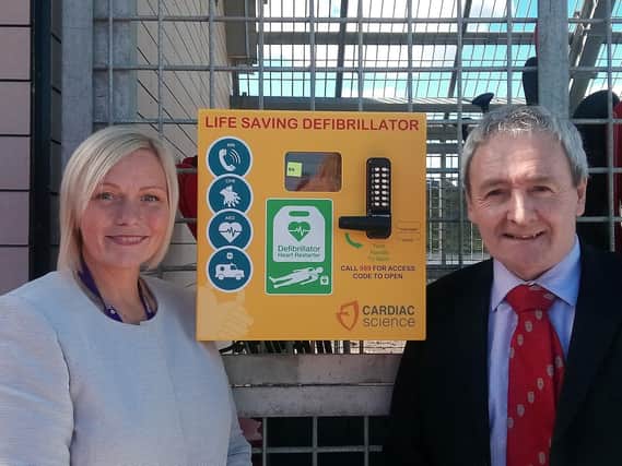 Cllr Leanne Kennedy and Cllr Kevin Shaw next to the new defibrillator.