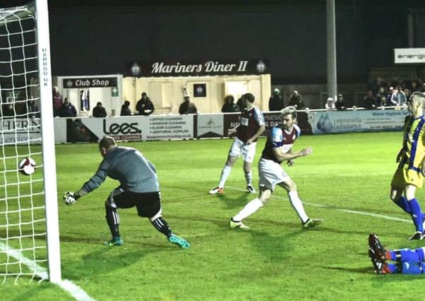 Carl Finnigan scores the first goal of the night for South Shields.