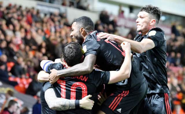 Sunderland are third in League One, three points off the top