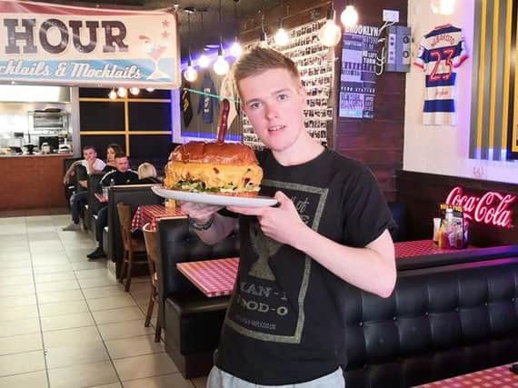Kyle Gibson with his mammoth burger challenge. Picture: Kyle Gibson.