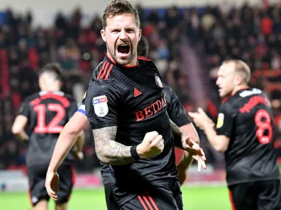 Chris Maguire celebrates his winning goal against Doncaster Rovers.