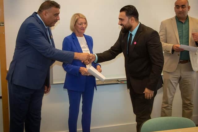 Dr Lynne McKenna (centre), Dean of the Faculty of Education and Society at the University of Sunderland, presents certificates to the Iraqi delegation.