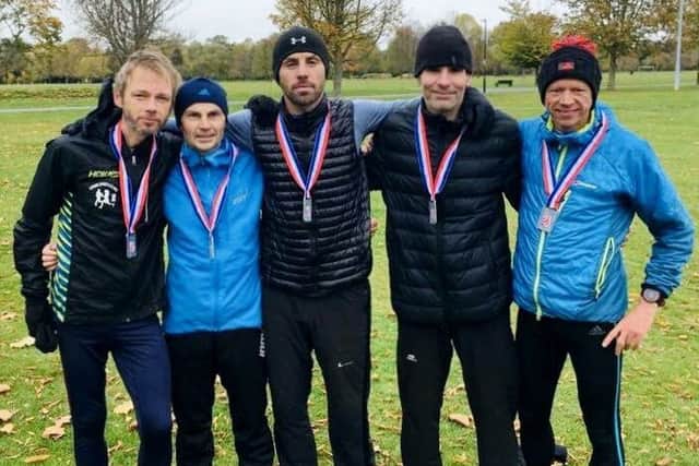 Mens team, left to right: Kevin Jeffress, Micky Thompson, Ian Dixon, Rob Walker and Steve MacMahon.
