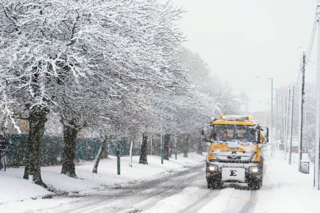 A gritter lorry in Greencroft, County Durham, as snow starts to fall heavily. Pic: Owen Humphreys/PA Wire.