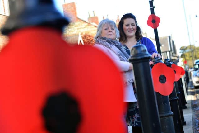 Joan Glass and Rebecca Higgins (R) with the East Boldon's giant poppy trail they have organised