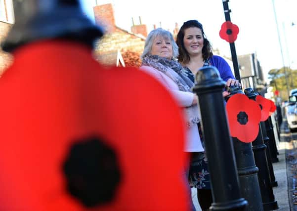 Joan Glass and Rebecca Higgins (R) with the East Boldon's giant poppy trail they have organised