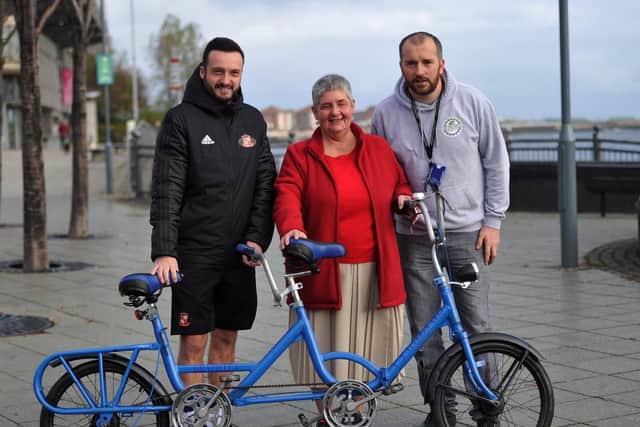 From left Kevin Darke and his mother Dorothy who is blind with Ritchie Duggan Jnr at St Peters riverside cycling route, providing bikes for affordable hire and loans.