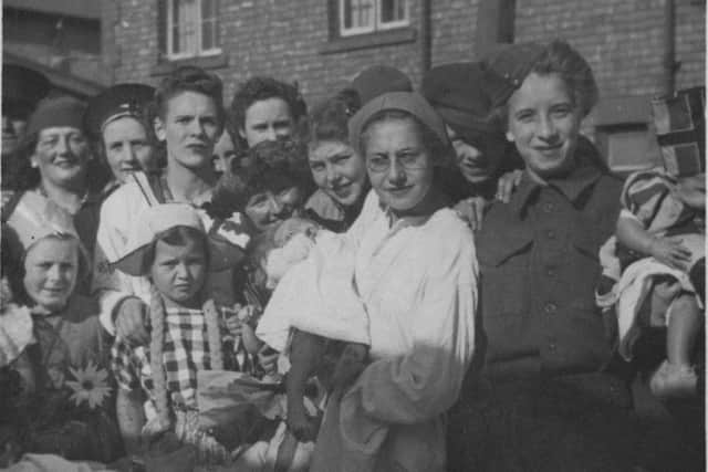 Julies family enjoying a party at the end of the Second World War. Her grandmother, Alice Hubbard nee Ryall, is pictured back left with a hat on. Her husband, James, served as a sailor in the First World War.