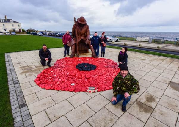 Volunteers who painted stones from the beach at Seaham and made a poppy next to the Tommy statue in 2016, l-r Andrew Harrison, Philip Ridley, Dave Routlledge, Tracy Spencer, Alex Tinkler and Dave McKenna