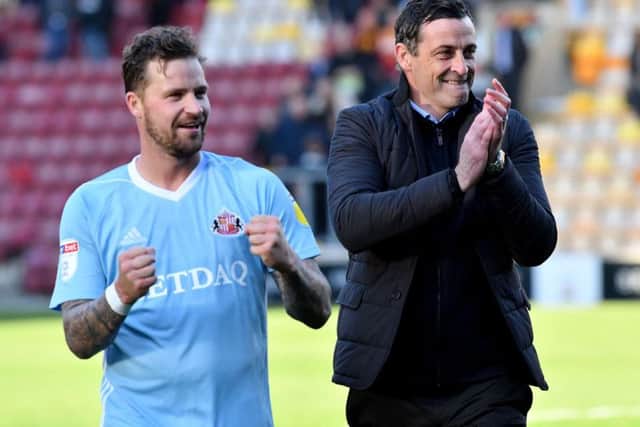 Chris Maguire and Jack Ross celebrate the win at Valley Parade