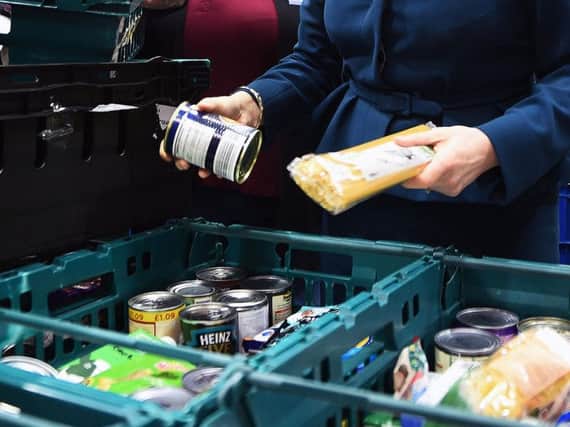 Food banks run by the Trussell Trust have handed out 13% more than they did a year ago. Pic: Andy Buchanan/PA.