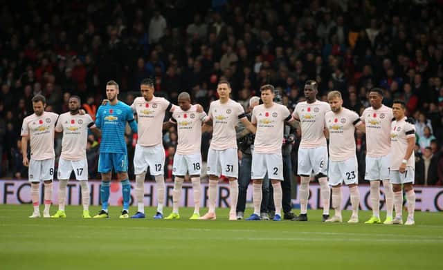 Manchester United players observe a minutes silence for Armistice Day, with Nemanja Matic deciding not to wear a poppy on his shirt.