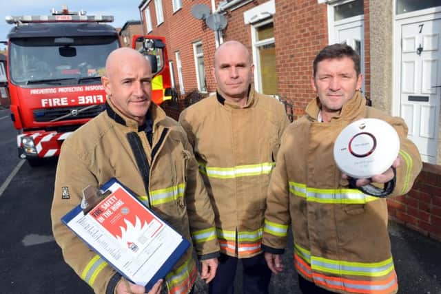 Firefighter Andy Fahey, watch manager Andy Smith and firefighter Bob Foster