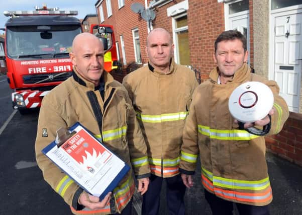 Firefighter Andy Fahey, watch manager Andy Smith and firefighter Bob Foster