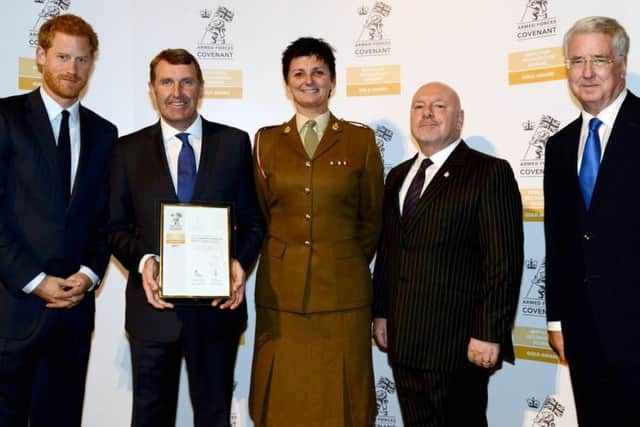Ken Bremner, chief executive of City Hospitals Sunderland NHS Foundation Trust, collecting an Armed Forces Covenant Gold Employer Recognition Award.