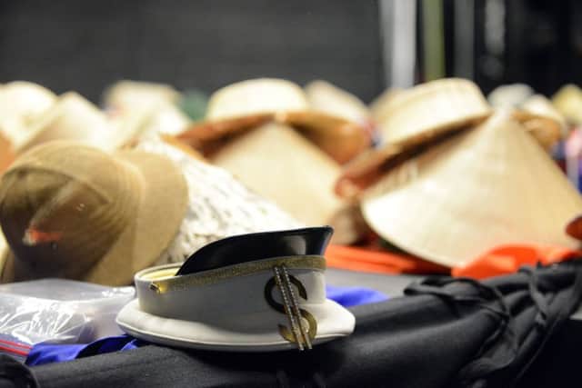 Some of the many hats used in the production