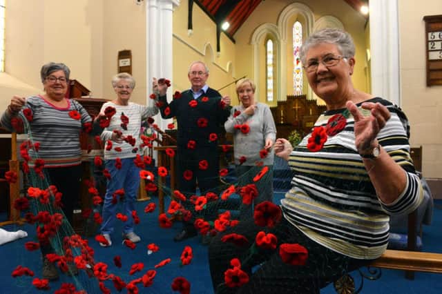 All Saints Ladies Fellowship knitted poppies for All Saints Church service.
From left Ann Jeffrey, Linda Hughes, church warden Stuart Cameron Doreen Crofts and Evelyn Gardner
