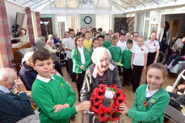 West Rainton Primary School pupils Joe Bartlett, 10, and Rebecca Maughan, 9, with resident and Land Army member Hilda Bush.