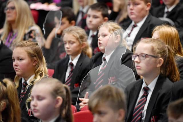 One of the 'silent silhouettes' placed between pupils attending the Red House Academy service.