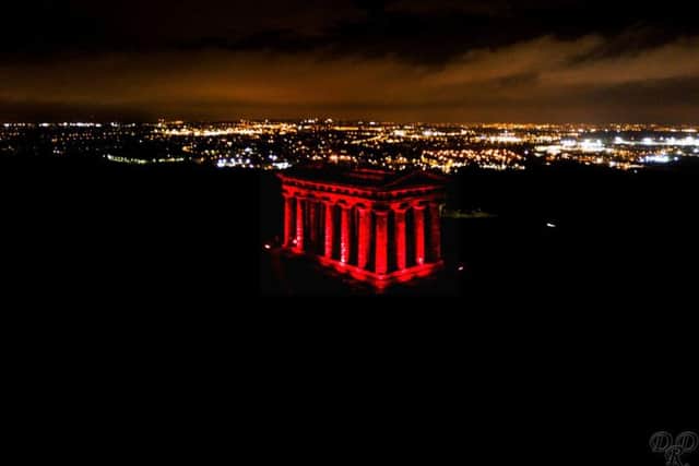 Penshaw Monument is lit up red to mark Remembrance Sunday. Pic: Mick Naisbitt.