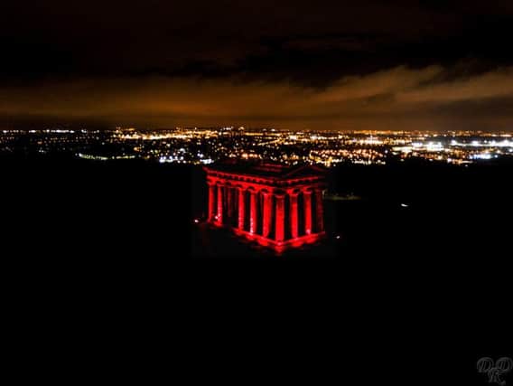 Penshaw Monument is lit up red to mark Remembrance Sunday. Pic: Mick Naisbitt.