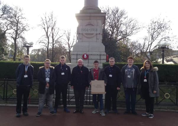 Sunderland College staff and students laying a wreath at the Sunderland Cenotaph.