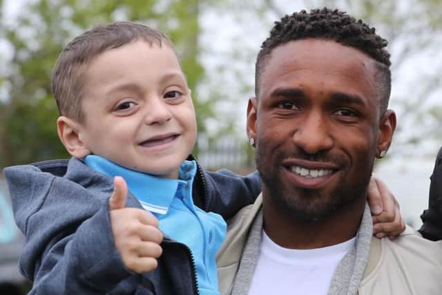Jermain Defoe recalled his 'amazing' memories of little fighter Bradley Lowery as he picked up his OBE today.