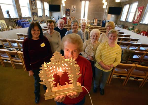 Houghton Methodist Chruch Christmas crib display is on show now.  Pictured is Hilary Brereton with the church members.