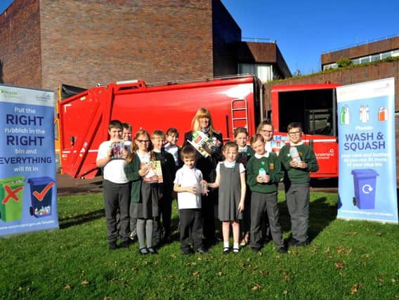 Coun Amy Wilson meets children from Broadway Juniors at the Civic Centre for a closer look at a recycling vehicle.