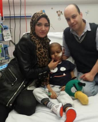 Farid in Newcastle's Royal Victoria Infirmary with parents Sherine and Ahmed.