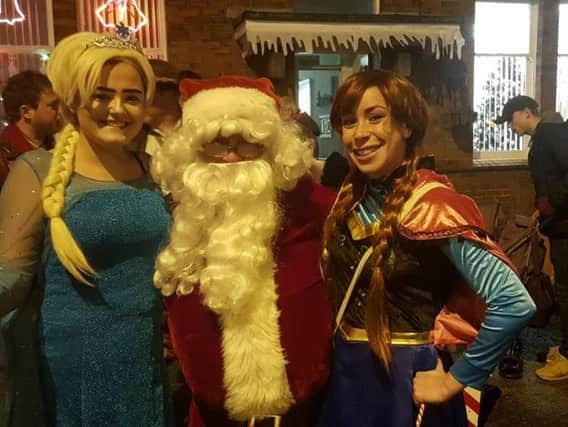 Santa Claus with Anna and Elsa from Frozen. Picture credit: Parker Trust