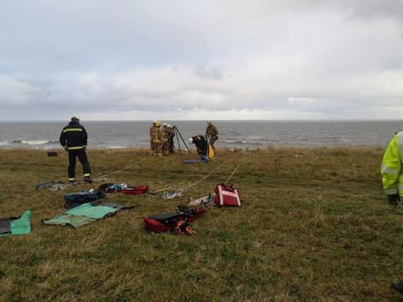 Firefighters on a cliff in Sunderland on which a dog needed rescuing from.