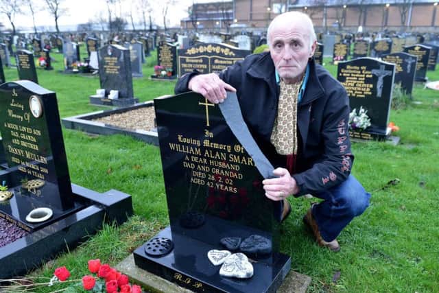 Jimmy Smart at the damaged grave of his late brother William Alan Smart. Picture by FRANK REID