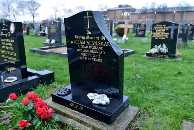 The damaged Headstone of William Alan Smart. Picture by FRANK REID