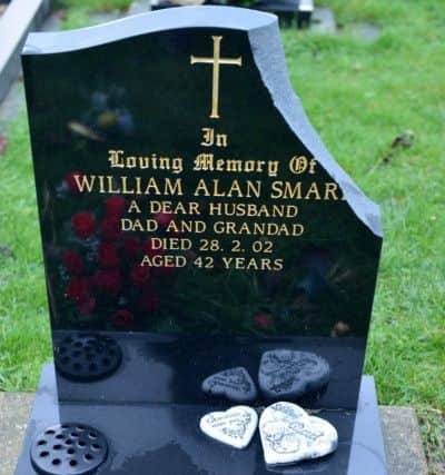 The damaged Headstone of William Alan Smart. Picture by FRANK REID