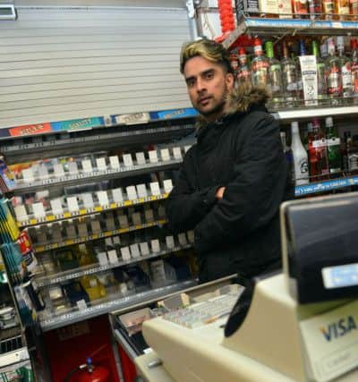 Dawdon Store owner Ali Zaman is angry over store break in and cigarette theft