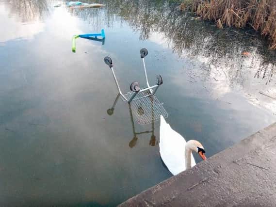 Flytippers have dumped items including shopping trolleys at the pond at Downhill Sports Complex