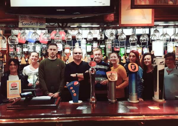 Staff and regulars celebrate at The Dolphin (from left) Lisa Smith; Kelly Kennedy ; Dan Bell; Kelvin Lamb; Peter Foster; Leanne Kennedy; Lou Weston; Vicky Magness  and Judith Crompton