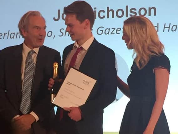 Kim Fletcher, chairman of the NCTJ, and Sky News presenter Sarah Hewson, congratulate Joe Nicholson on his award.