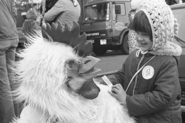 Sunderland Empire panto parade, December 1985. Dawn O'Brien from Pallion making friends with a giant chicken.