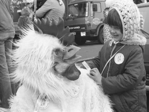 Sunderland Empire panto parade, December 1985. Dawn O'Brien from Pallion making friends with a giant chicken.