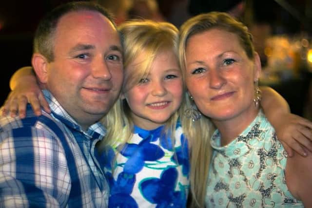 Becky Timby with daughter Brooke Priest, 11 and partner Brian Priest.