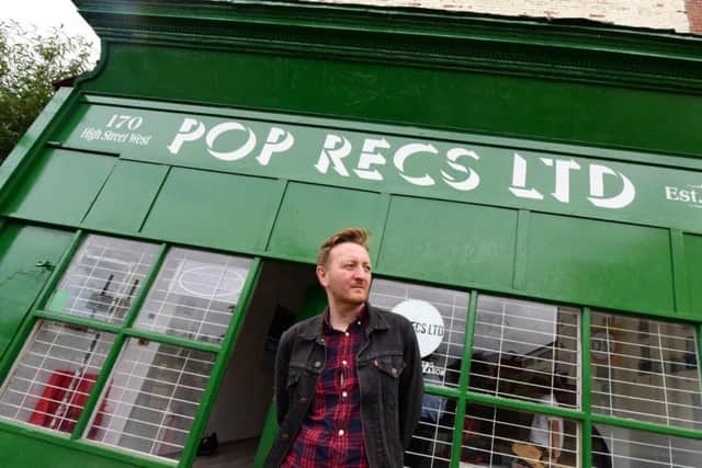 Dave Harper outside the historic buildings in High Street West