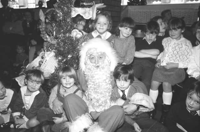 Santa with his adoring young fans in 1986.