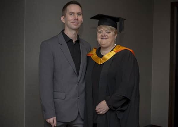 Graduate Alison Stiles Johnson attends the Sunderland University Winter Graduation event at the Stadium of Light with husband Michael