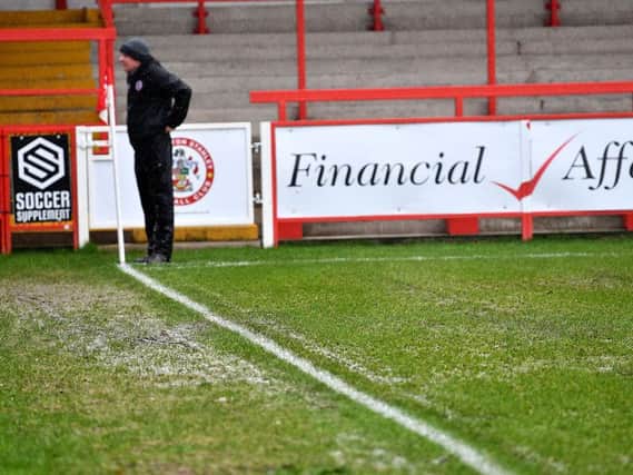 A second half downpour made the Accrington Stanley pitch unplayable