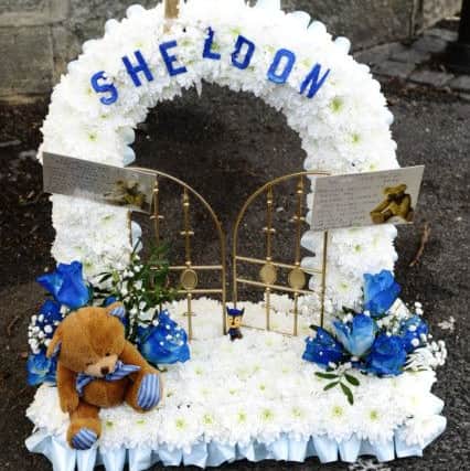 Flowers in memory of Sheldon Farnell.