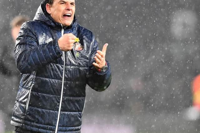 Chris Coleman celebrates a Sunderland win over Derby County